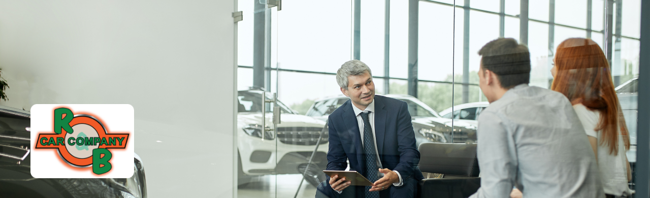 Customers visiting the R&B Car Company dealership showroom in Elkhart for vehicle financing and trade-in options