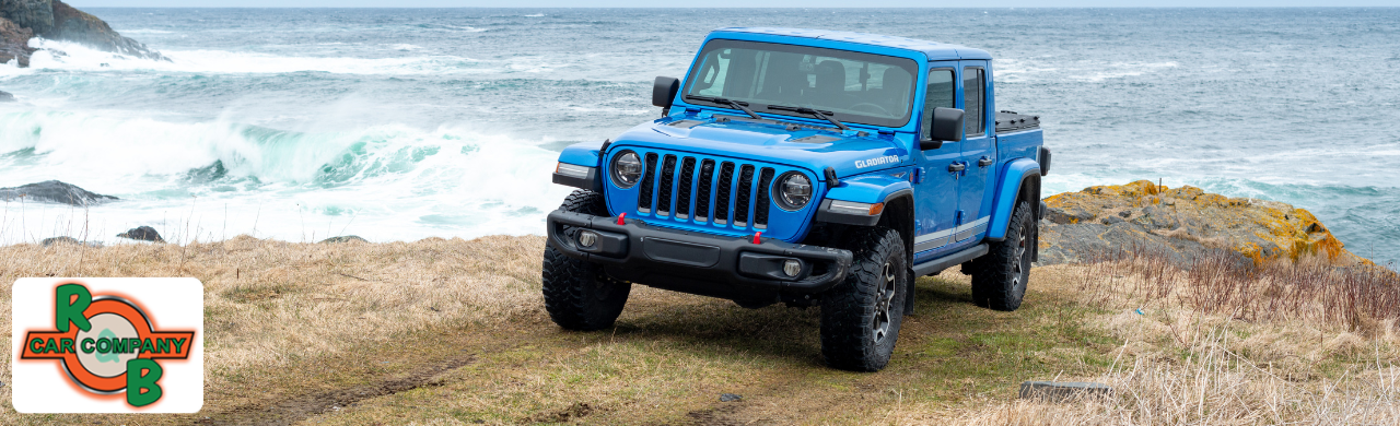 Jeep Gladiator truck driving on an off-road trail near the Indiana countryside