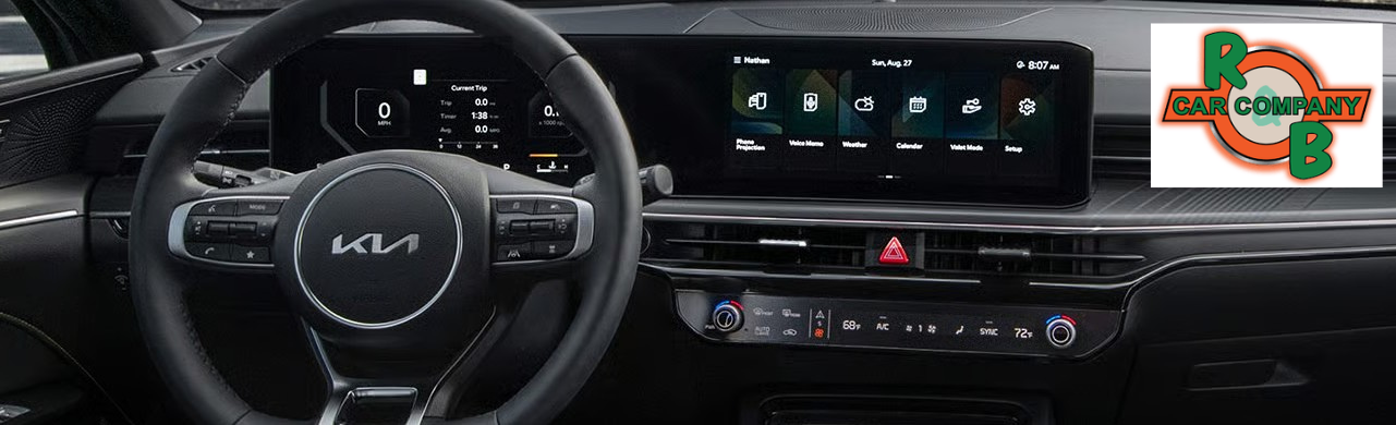 Interior view of a Kia K5 GT-Line highlighting touchscreen display, modern dashboard layout, and comfortable seating.
