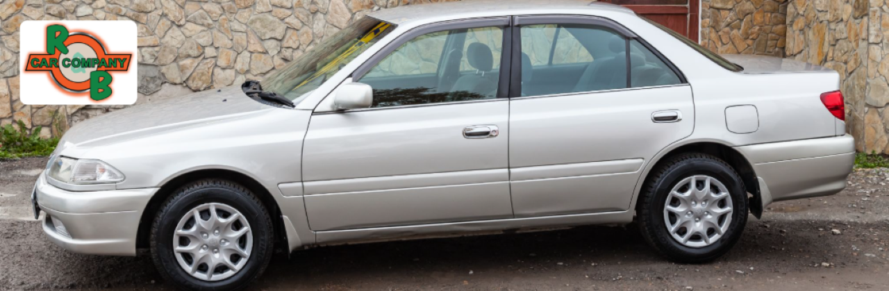 R&B Car Company sales associate helping customers explore used car financing options in Indiana.