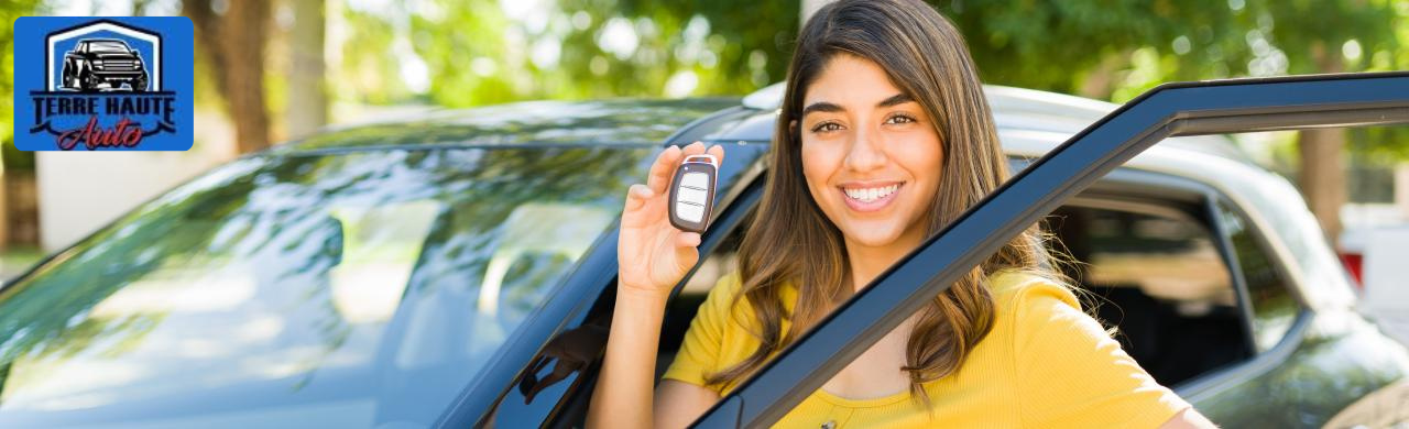 Friendly dealership staff assisting a family at Terre Haute Auto showroom