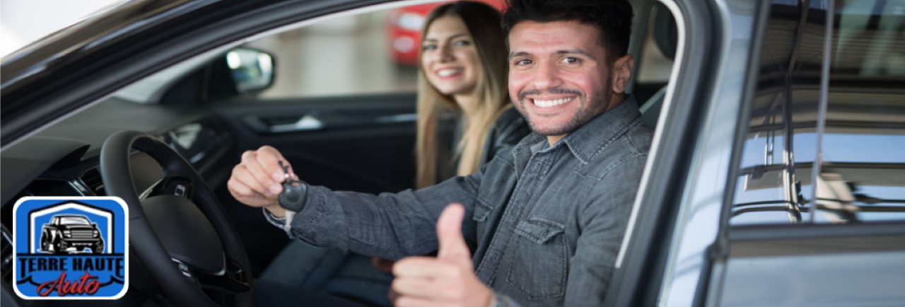 Friendly dealership team helping a local family explore pre-owned SUVs for sale near them.