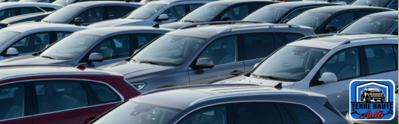  Sales team at Terre Haute Auto working with a local customer on a vehicle trade-in offer.