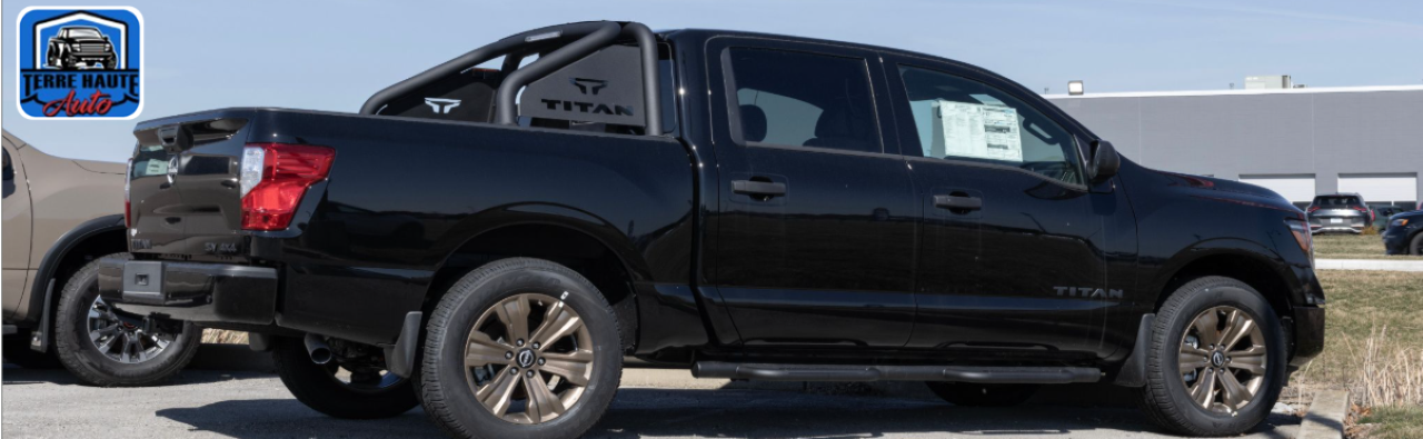 A diverse lineup of used trucks for sale at the Terre Haute Auto dealership lot in Terre Haute, IN.